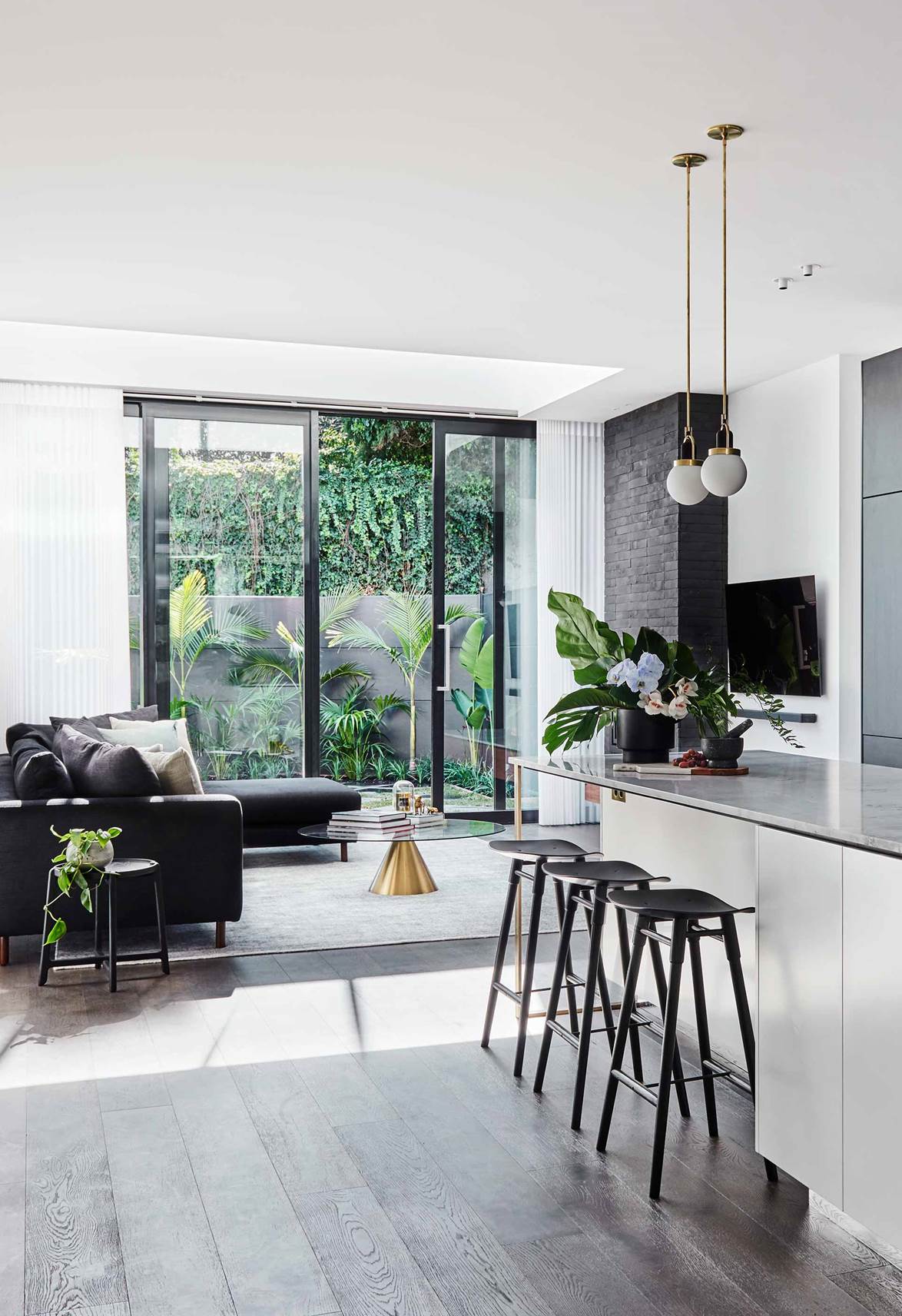 Open plan kitchen with black accents
