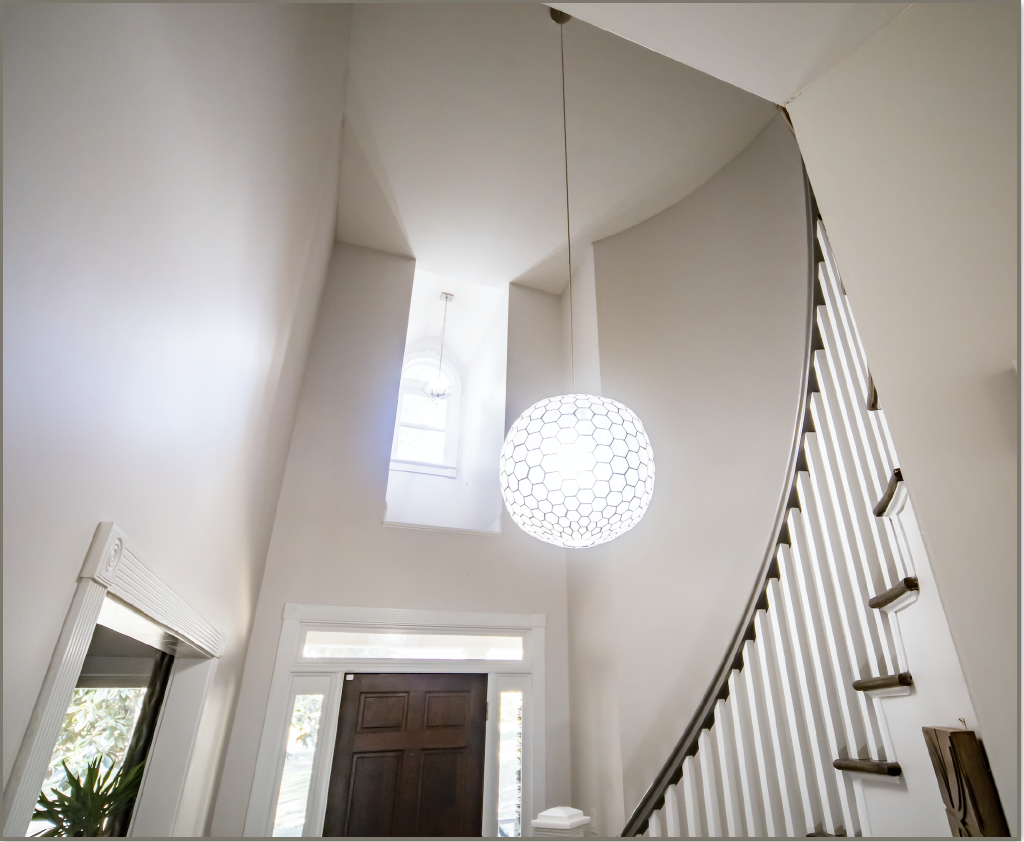 Double height ceiling with modern chandelier